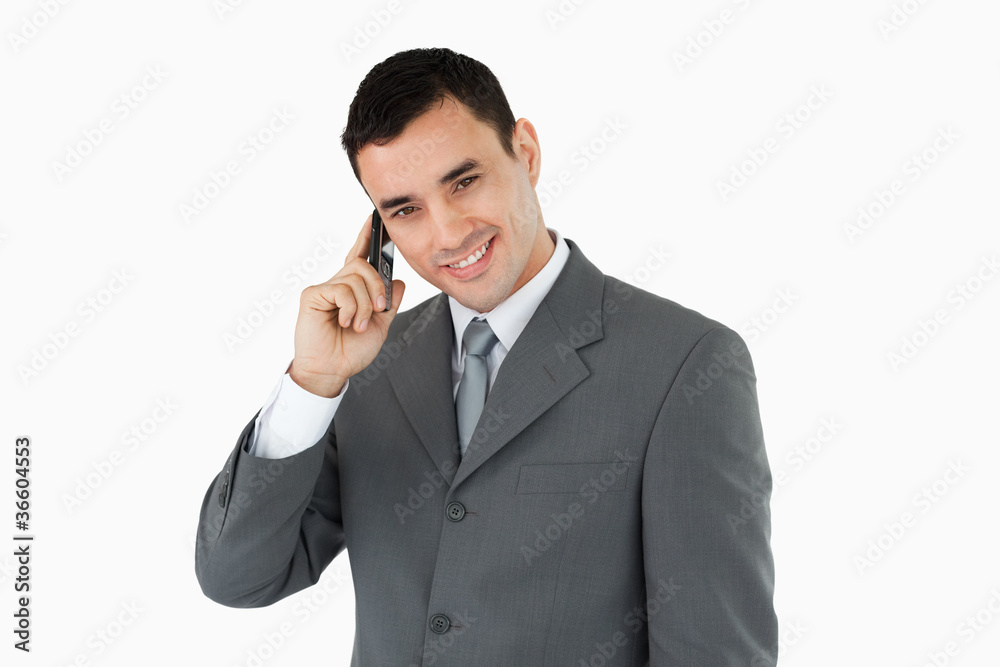 Smiling businessman on his phone Smiling businessman on his phone
