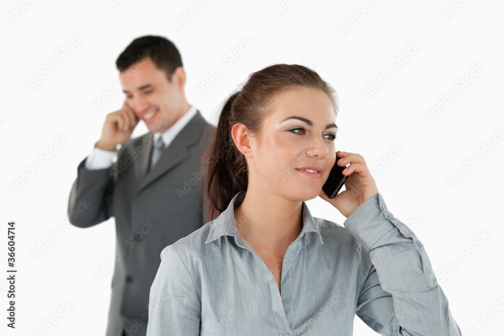 Close up of business partners talking on the phone Close up of business partners talking on the phone