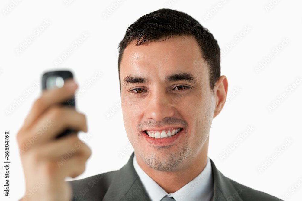 Close up of businessman holding his cellphone Close up of businessman holding his cellphone