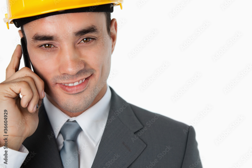 Close up of confident smiling architect on the phone Close up of confident smiling architect on the phone
