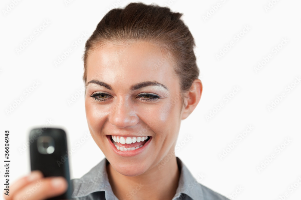 Close up of businesswoman being happy about text message Close up of businesswoman being happy about text message
