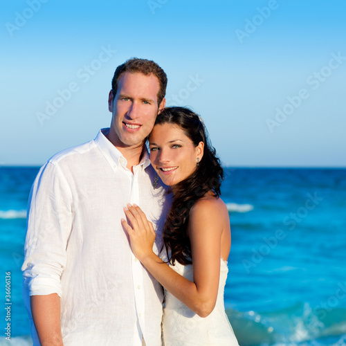 couple in love hug in blue sea vacation
