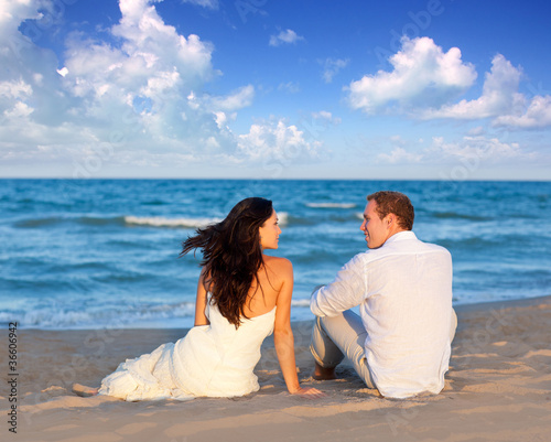 couple in love sitting in blue beach © lunamarina
