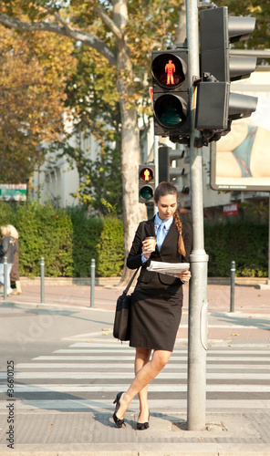 businesswoman waiting on the traffic light photo