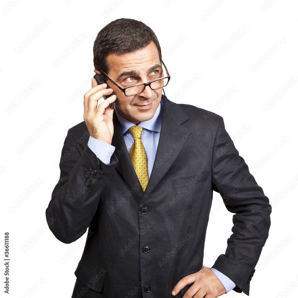 Portrait of confident businessman talking at the phone Portrait of confident businessman talking at the phone