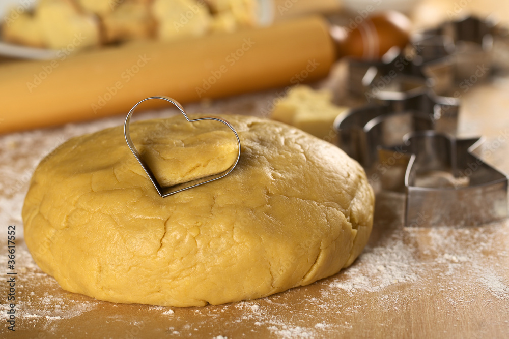 Heart shaped cookie cutter on cookie dough Heart shaped cookie cutter on cookie dough