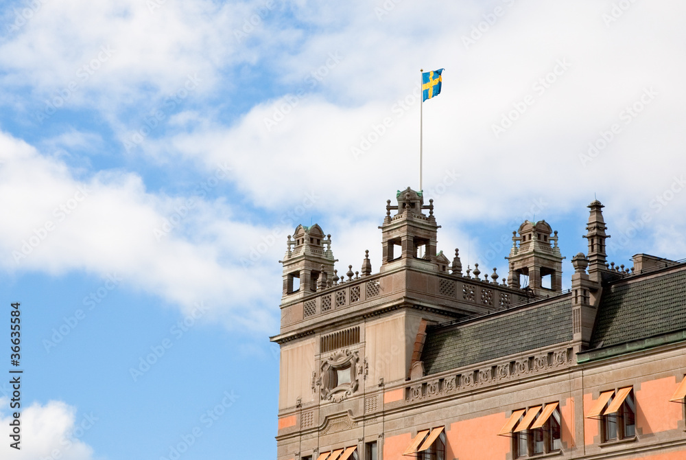 Swedish flag on roof of old house in Stockholm