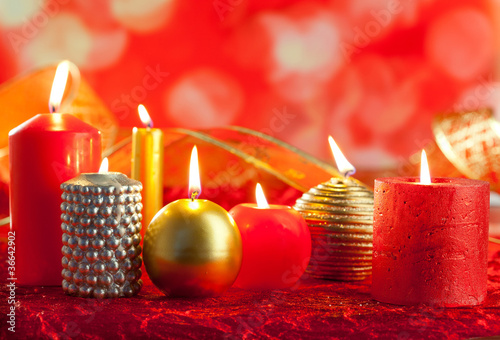Christmas card candles red and golden in a row