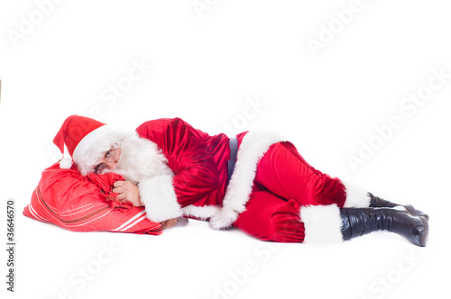 Santa resting on the bag with presents.