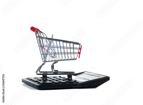 shopping cart on calculator isolated on white © farizaa