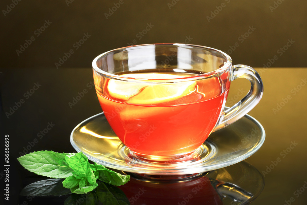 nice cup of tea and mint on yellow background nice cup of tea and mint on yellow background