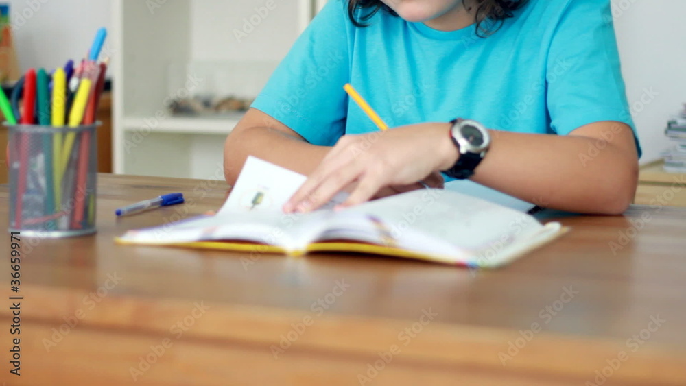 Boy hands doing homework Boy hands doing homework