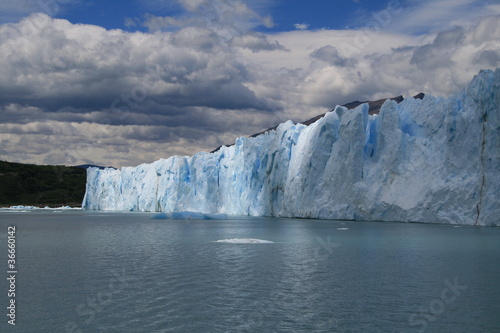 Perito Moreno glacier with clouds and mountains © guppyimages