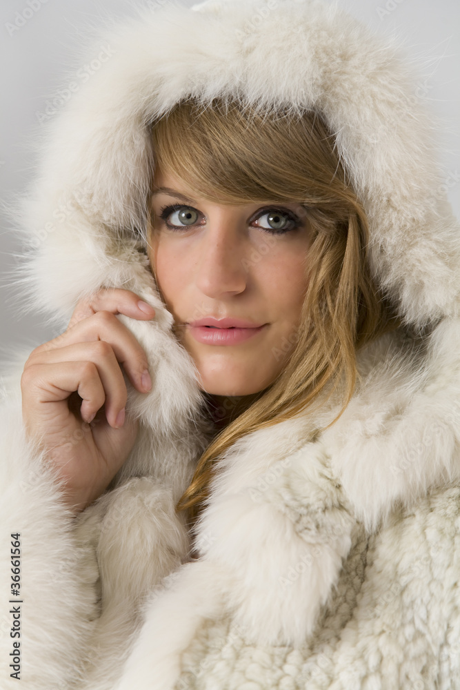 Portrait of attractive woman with real fur hood Portrait of attractive woman with real fur hood