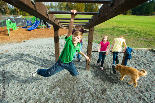 Obraz na plátne Boy playing on a school playground