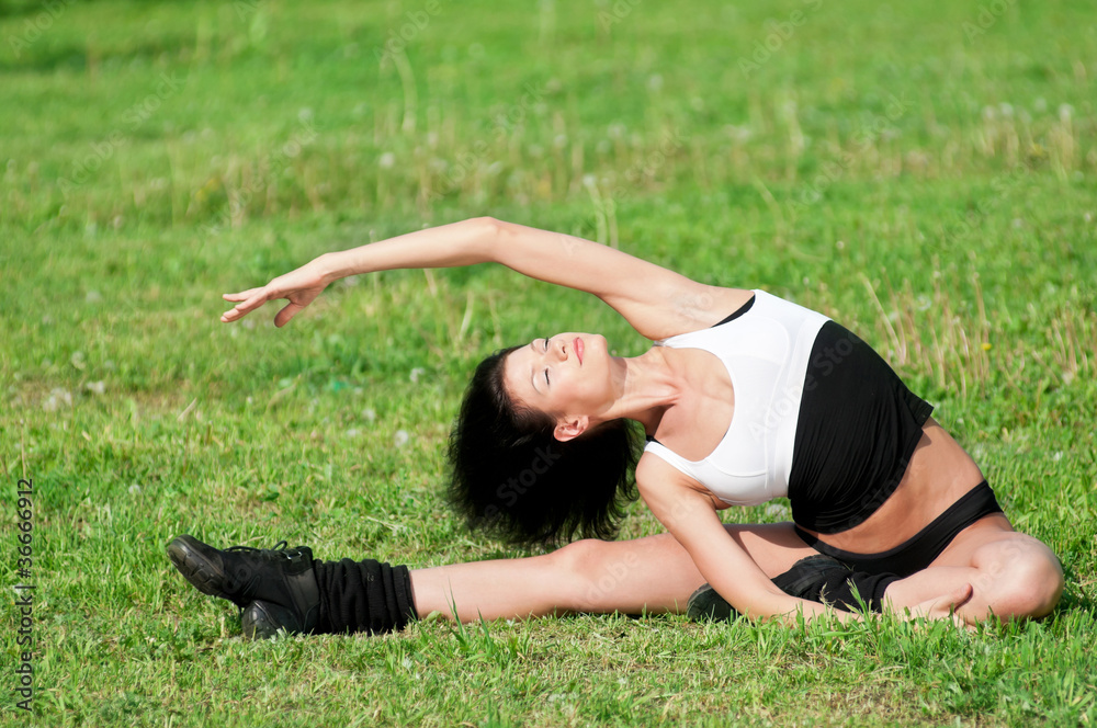 Fototapeta premium Woman doing stretching exercise. Yoga