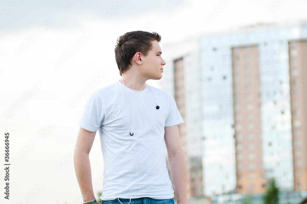 Fototapeta premium Portrait of young attractive man at park