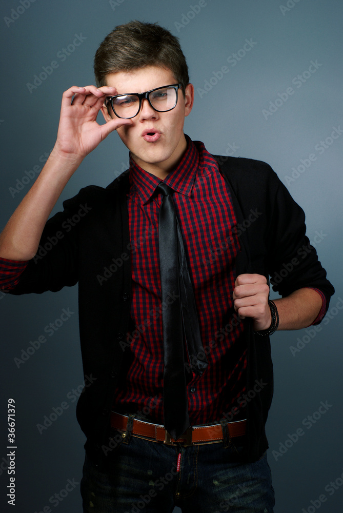 Fototapeta premium Fashion portrait of young man with glasses