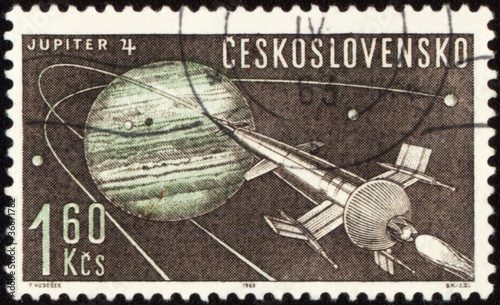Fototapeta Naklejka Na Ścianę i Meble -  Postage stamp with Planet Jupiter and spaceship