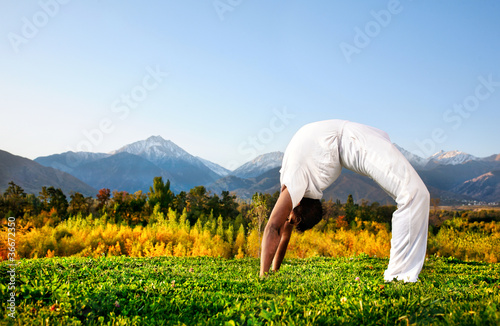 Yoga chakrasana wheel pose photo