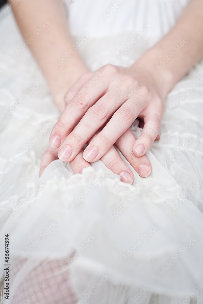 Girl with hands on lap