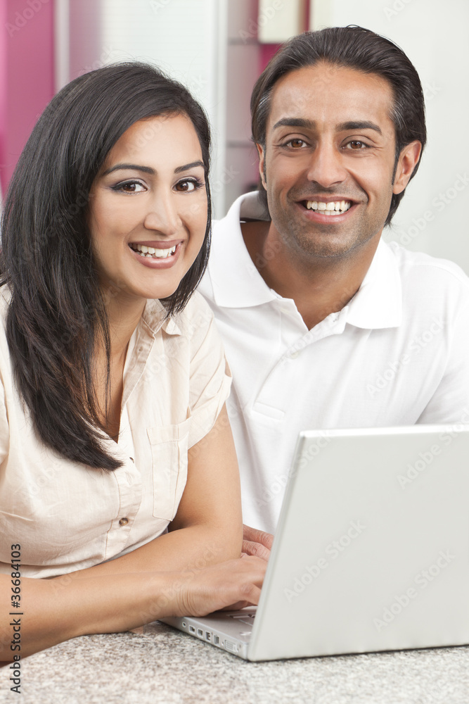 Asian Indian Man & Woman Couple Using Laptop Computer Asian Indian Man & Woman Couple Using Laptop Computer