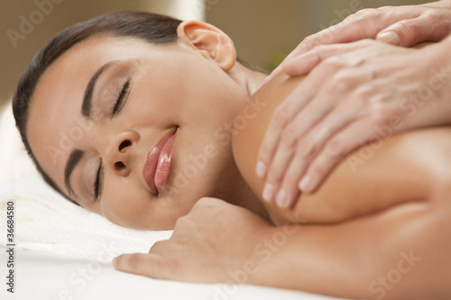 Woman At Health Spa Having Relaxing Massage