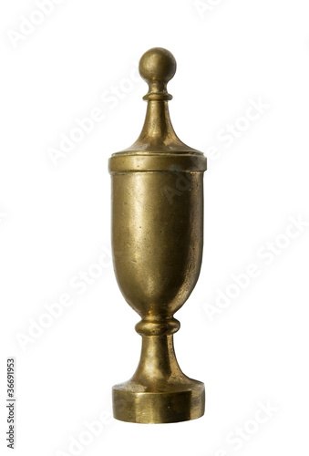 antique brass finial on a white background