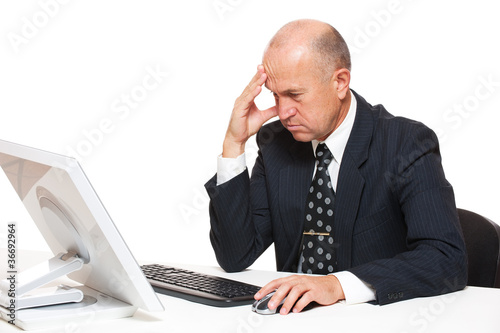 sad businessman looking in monitor