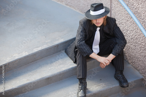 Interesting young man wearing Zoot Suit taking on downtown.