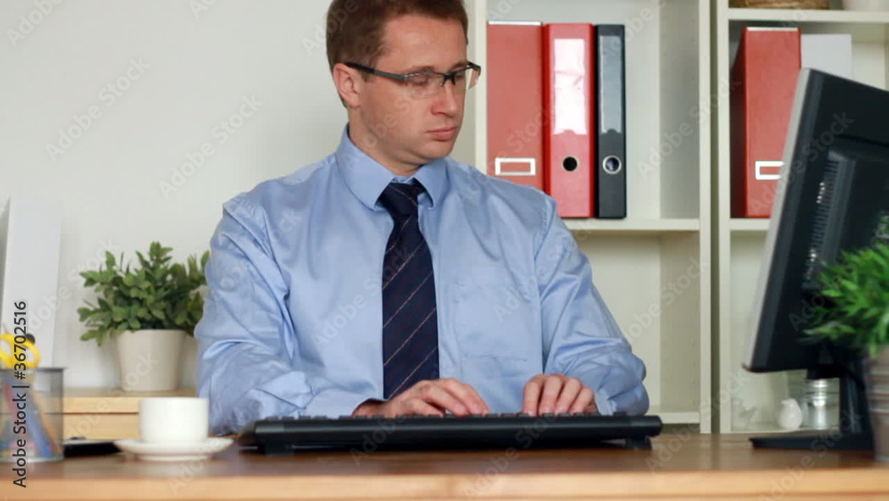 Businessman working on computer Businessman working on computer