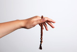 A hand and rosary