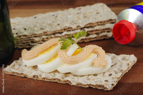Crispbread with egg slices and roe spread