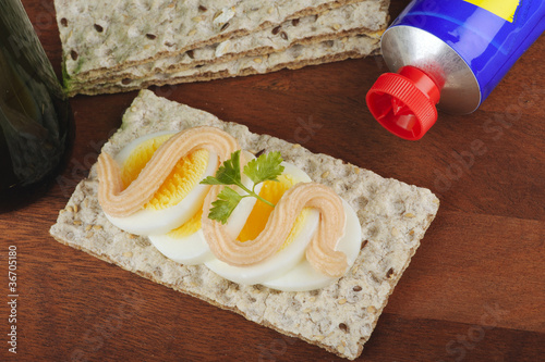 Crispbread with egg slices and roe spread