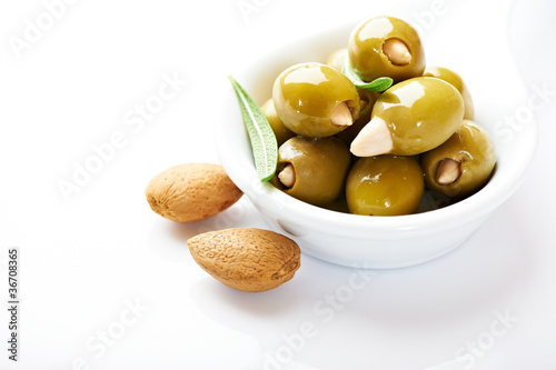 Almond stuffed olives on white background