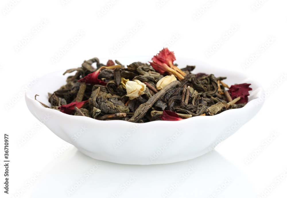 Green dry jasmin tea leaves in plate isolated on white Green dry jasmin tea leaves in plate isolated on white