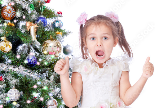 beautiful girl with a Christmas tree