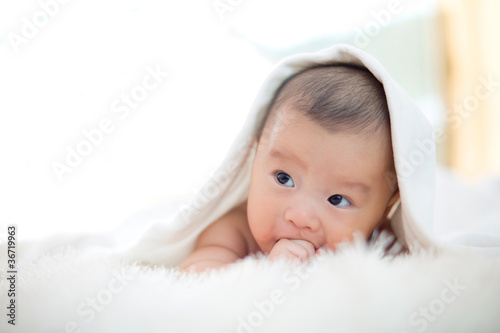 cute baby lie on bed