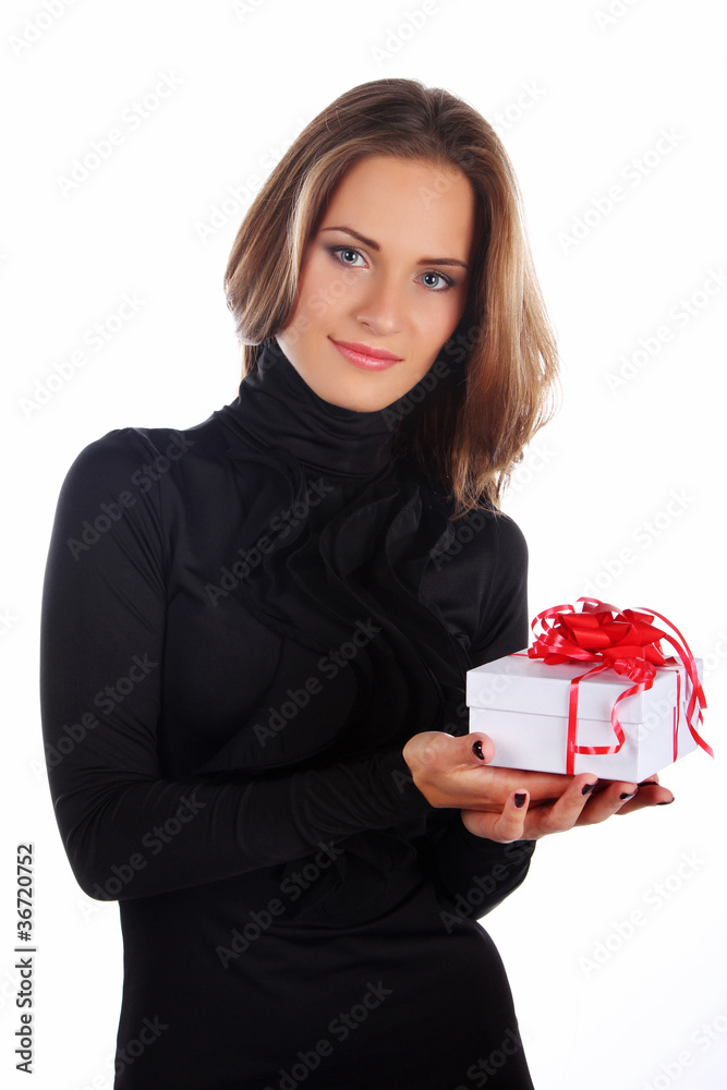 Image of brunette female holding christmas gift Image of brunette female holding christmas gift