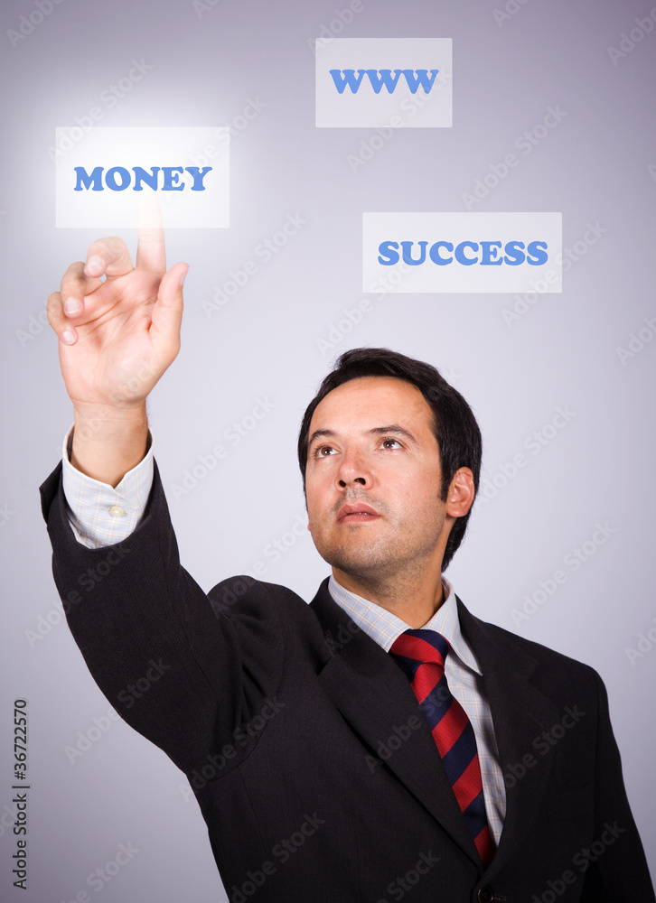 Young businessman pressing a digital key
