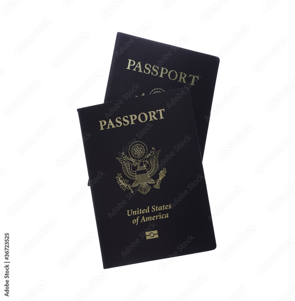 Front view of two passports isolated on white with clipping map Front view of two passports isolated on white with clipping map