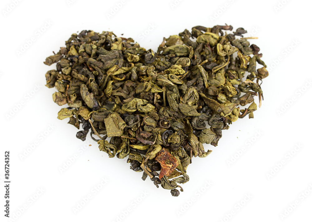 green dry tea heart shape isolated on white green dry tea heart shape isolated on white