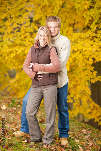 Autumn love couple hugging happy in park © CandyBox Images