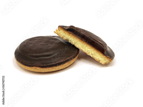 Bild auf Leinwand Cookies covered with chocolate and filled with jam