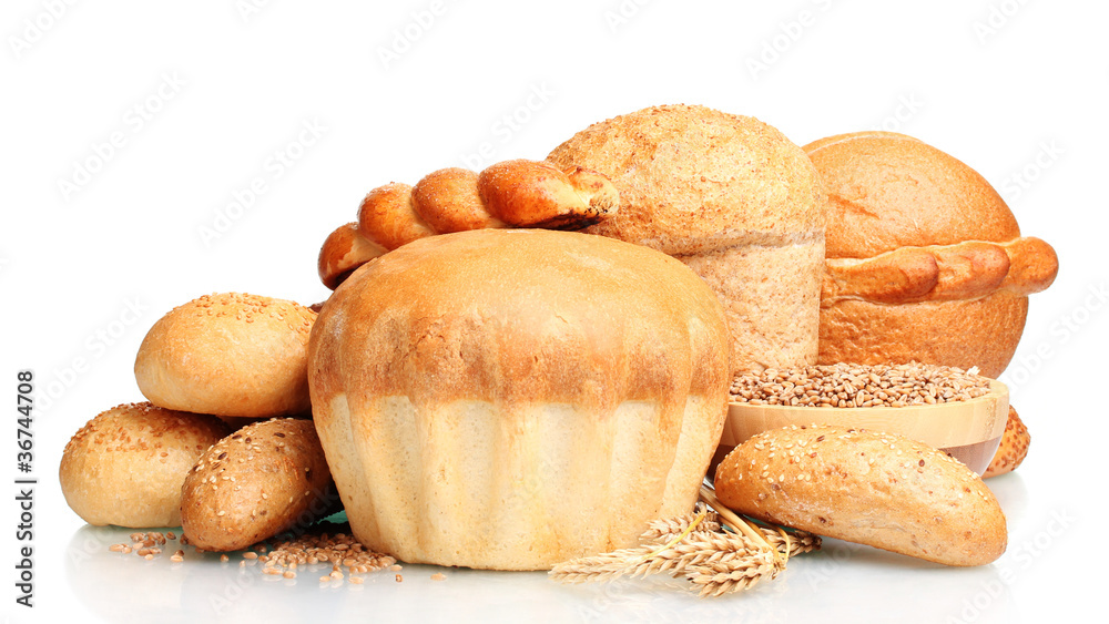 delicious round bread, buns and wheat isolated on white