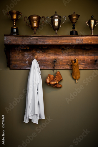 Antique football equipment and trophies in a vintage locker room