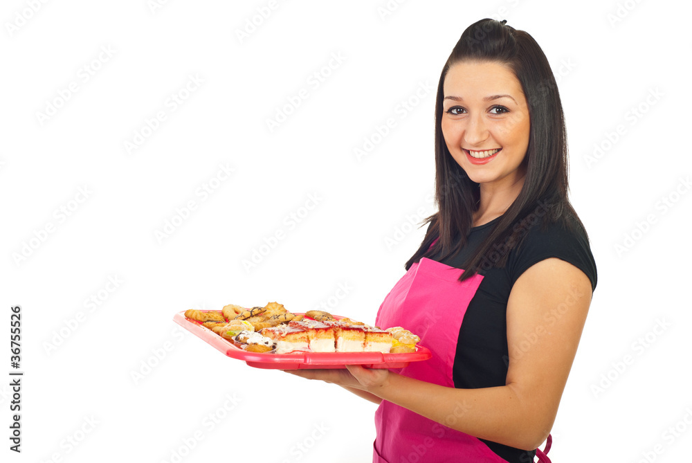Smiling confectioner woman holding cookies Smiling confectioner woman holding cookies