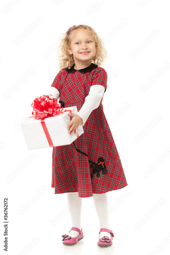 Full length of little girl holding her Christmas present Full length of little girl holding her Christmas present