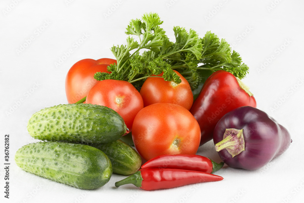 Vegetables and herbs on a white background