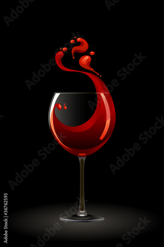 Glass of red wine on a black background